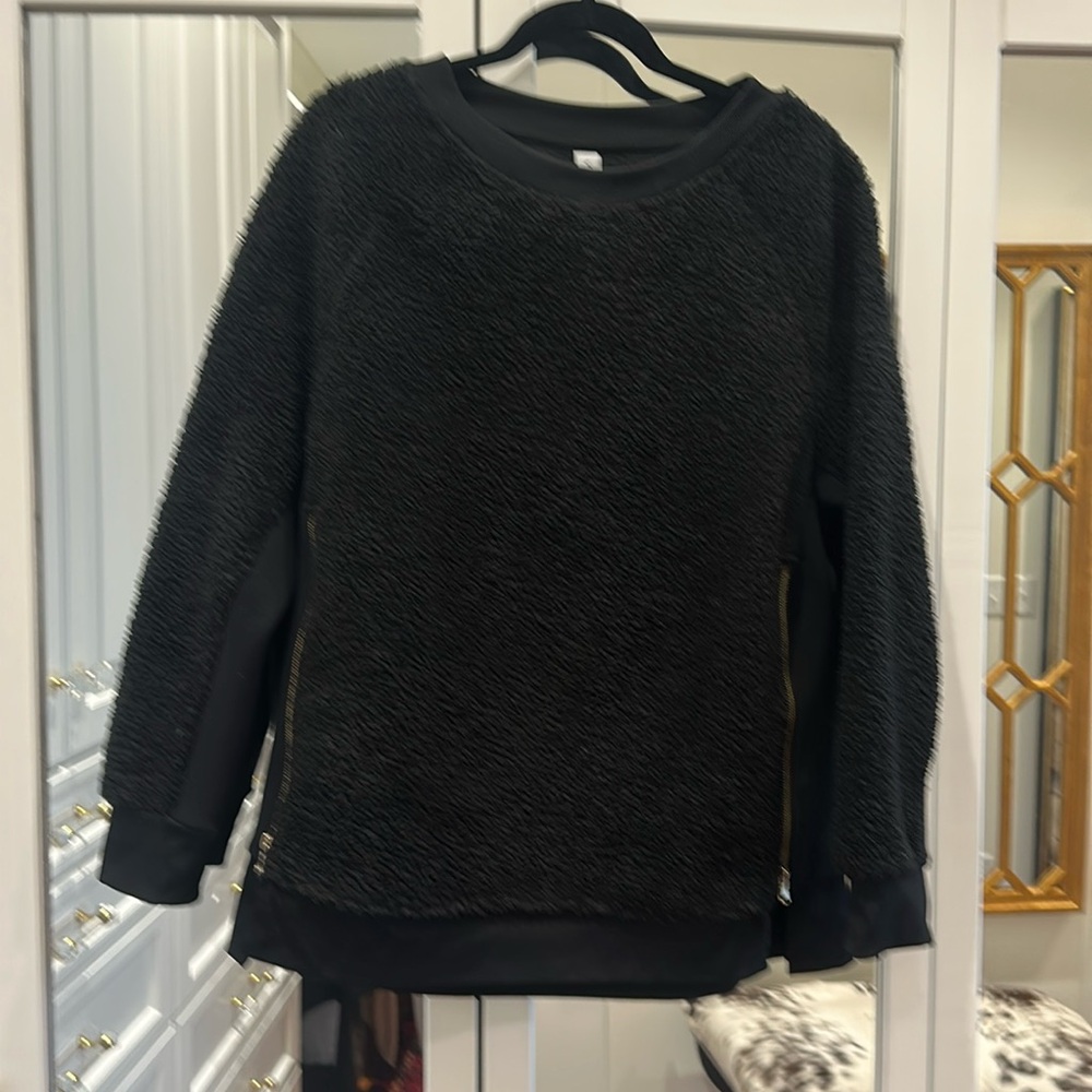 Black sweatshirt with gold zippers
